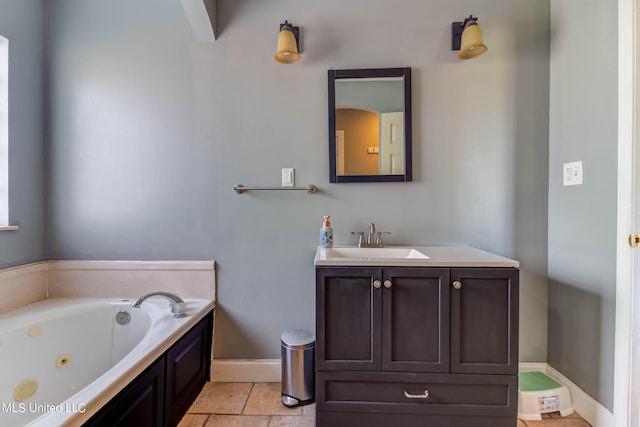 bathroom featuring vanity, tile patterned floors, and a washtub