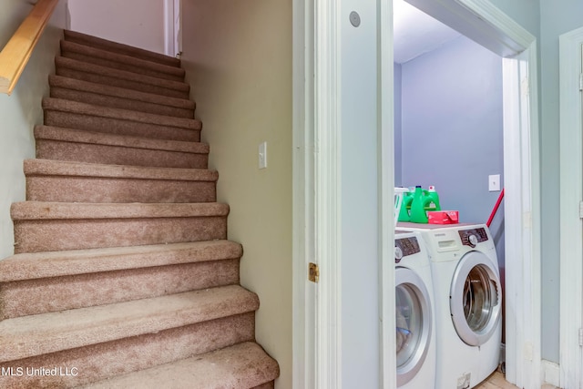 laundry room featuring washing machine and dryer