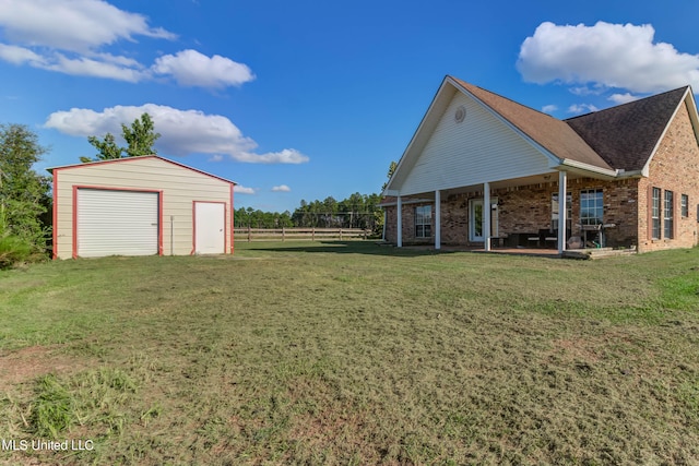 view of yard with an outbuilding and a garage