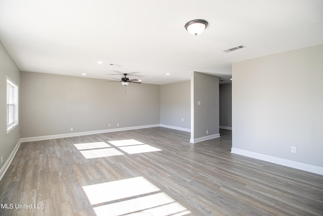 spare room with ceiling fan and hardwood / wood-style floors