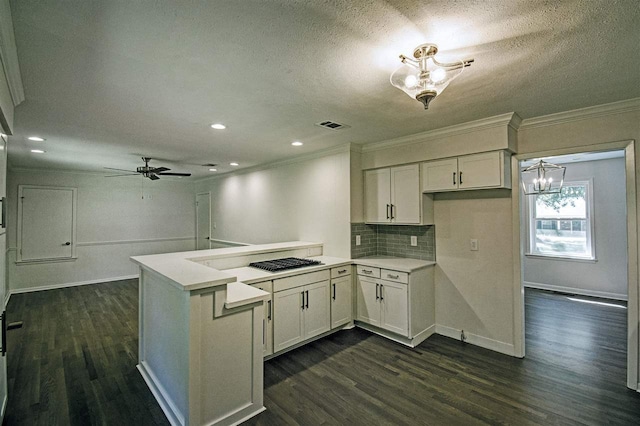 kitchen with white cabinetry, dark wood-type flooring, and kitchen peninsula