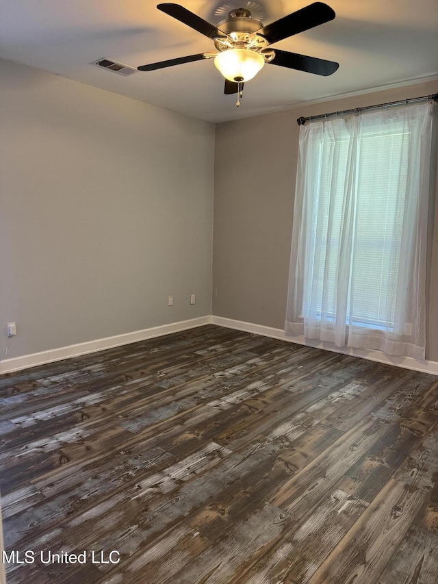 5205 Marthavale Cv, Southaven, MS 38671 - spare room featuring dark wood-style flooring, baseboards, and ceiling fan