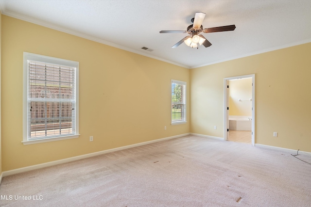 unfurnished room featuring ornamental molding, light carpet, and ceiling fan