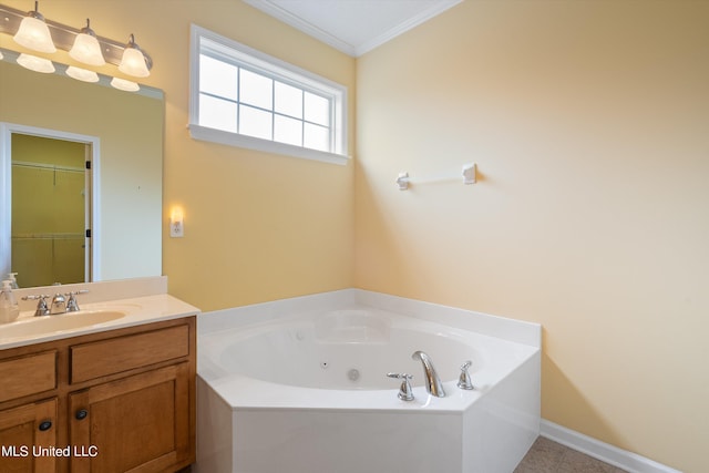 bathroom with vanity, crown molding, a tub, and tile patterned floors