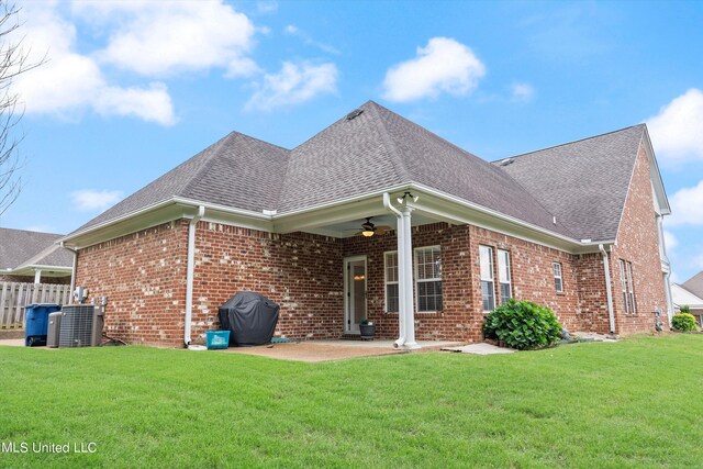 rear view of house featuring a patio, central AC, a lawn, and ceiling fan