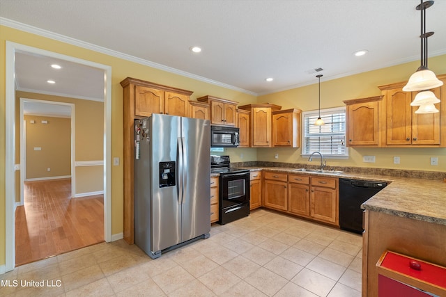 kitchen featuring sink, black appliances, hanging light fixtures, and crown molding