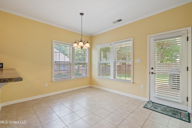 unfurnished dining area with a notable chandelier, a textured ceiling, light tile patterned floors, and crown molding