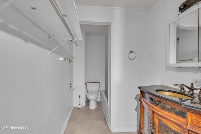 full bathroom with toilet, baseboards, and vanity