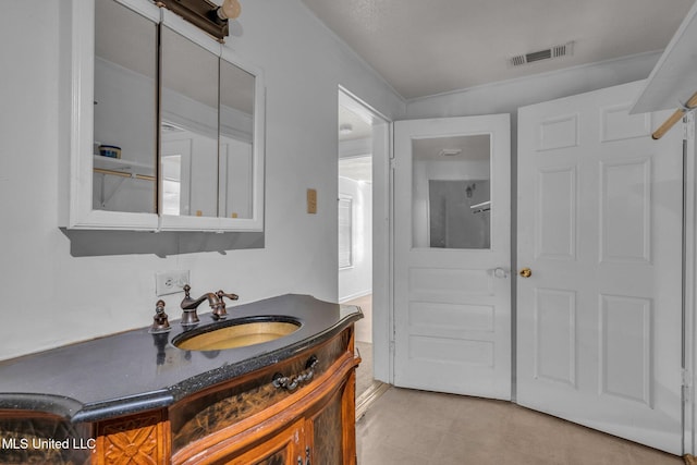 bathroom with a sink and visible vents