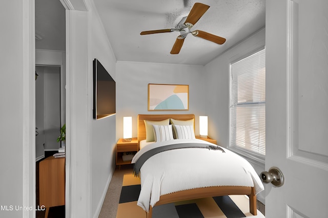 bedroom featuring carpet, ceiling fan, and baseboards