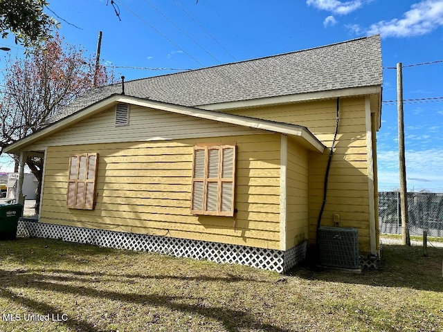 view of property exterior featuring cooling unit and fence