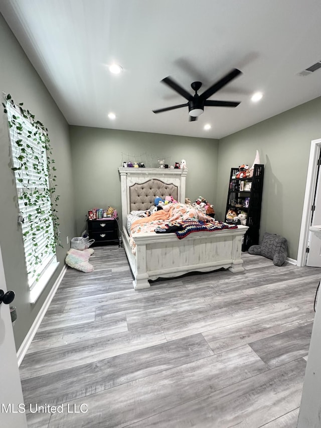 bedroom with baseboards, recessed lighting, light wood-style flooring, visible vents, and ceiling fan