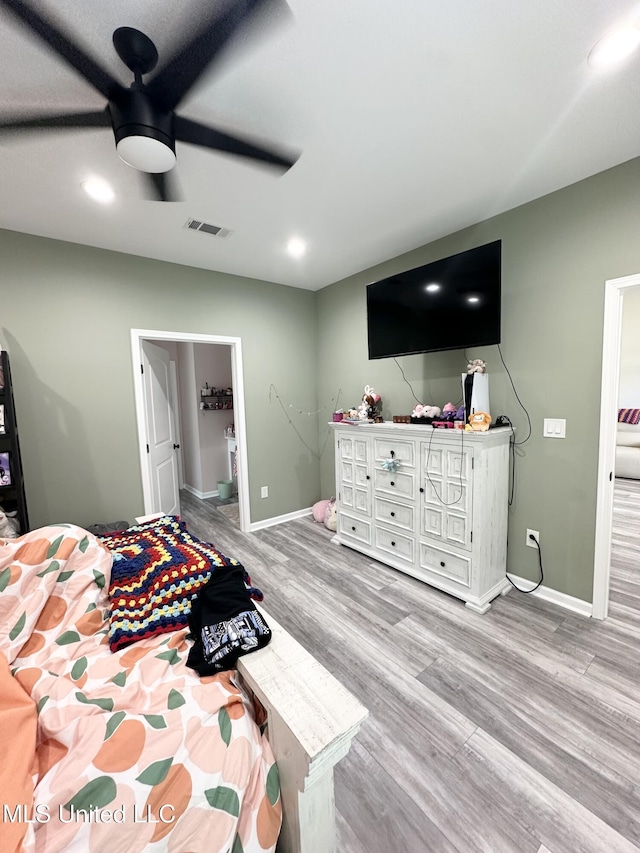 bedroom with visible vents, baseboards, recessed lighting, and wood finished floors
