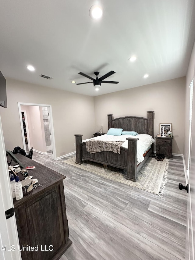 bedroom with light wood-style floors, visible vents, and recessed lighting