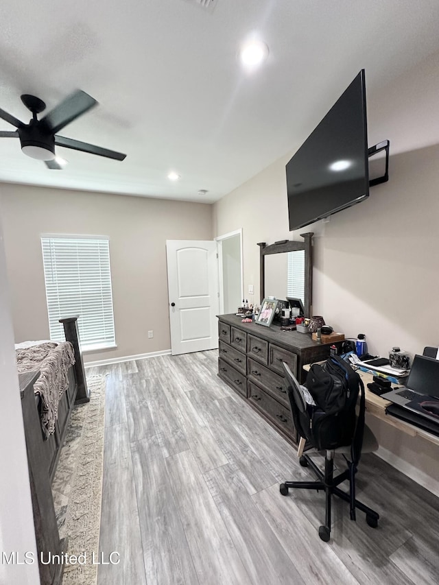 office space featuring wood finished floors, baseboards, a ceiling fan, and recessed lighting