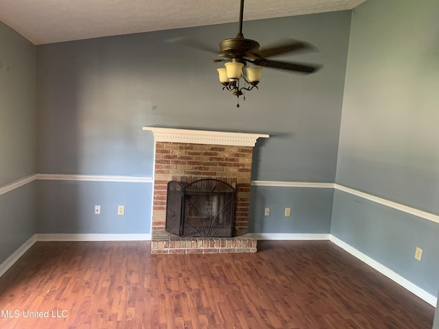4263 Cypress Dr, Jackson, MS 39212 - unfurnished living room with wood finished floors, a brick fireplace, ceiling fan, and baseboards