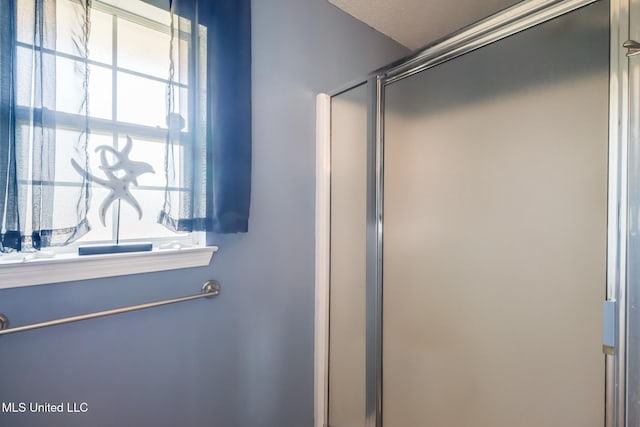 bathroom featuring an enclosed shower