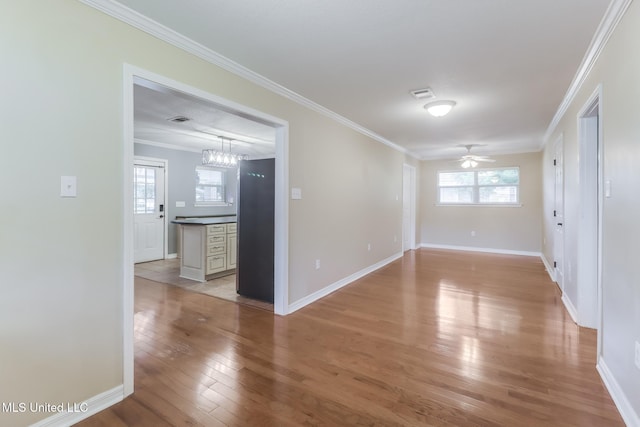 31 55th St, Gulfport, MS 39507 - unfurnished room featuring light wood finished floors, crown molding, and ceiling fan