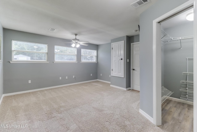 31 55th St, Gulfport, MS 39507 - unfurnished bedroom with light carpet and ceiling fan