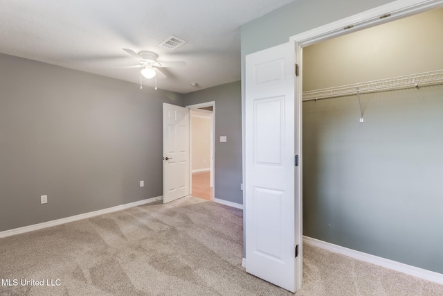 31 55th St, Gulfport, MS 39507 - unfurnished bedroom with light colored carpet, a closet, and ceiling fan