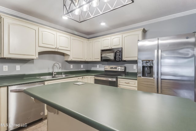 31 55th St, Gulfport, MS 39507 - kitchen featuring appliances with stainless steel finishes, cream cabinets, dark countertops, crown molding, and recessed lighting