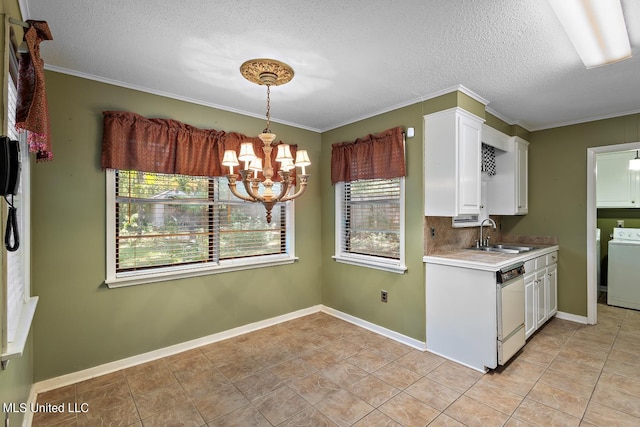 kitchen featuring dishwasher, washer / clothes dryer, sink, crown molding, and white cabinetry