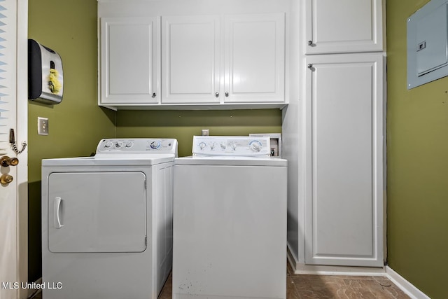 laundry area featuring cabinets and separate washer and dryer