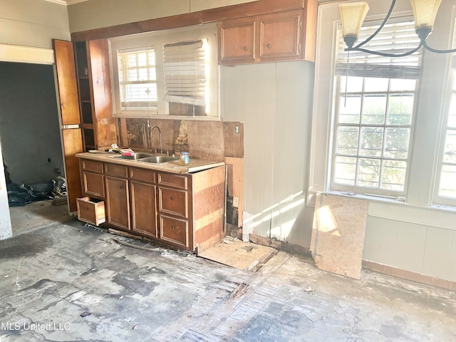 kitchen featuring sink, a wealth of natural light, and pendant lighting