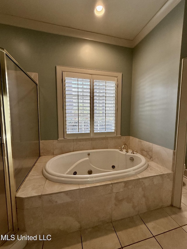 full bath with a jetted tub, tile patterned flooring, and crown molding