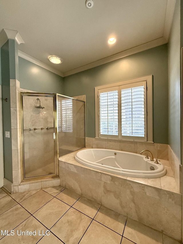 full bathroom with a stall shower, tile patterned flooring, a garden tub, and crown molding