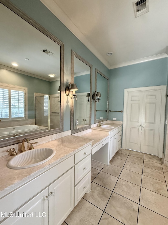 bathroom with a stall shower, tile patterned floors, visible vents, and vanity