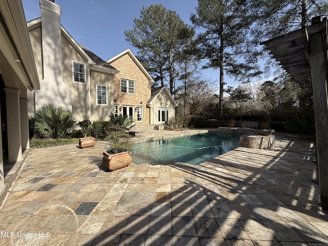 view of pool featuring a fenced in pool and a patio area