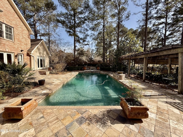 view of swimming pool with a patio area and a fenced in pool