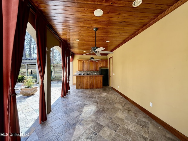 view of patio / terrace with fence and ceiling fan