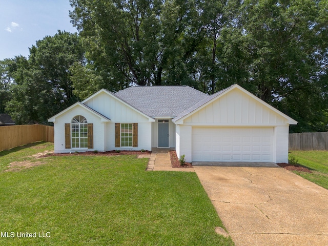 406 Twisted Oak Cv, Richland, MS 39218 - view of front of house featuring board and batten siding, a shingled roof, concrete driveway, and brick siding