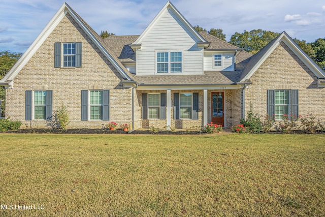 5640 Drew Glazer Dr, Olive Branch, MS 38654 - view of front of home featuring brick siding, a front yard, roof with shingles, and covered porch
