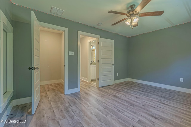 unfurnished bedroom featuring light hardwood / wood-style flooring and ceiling fan