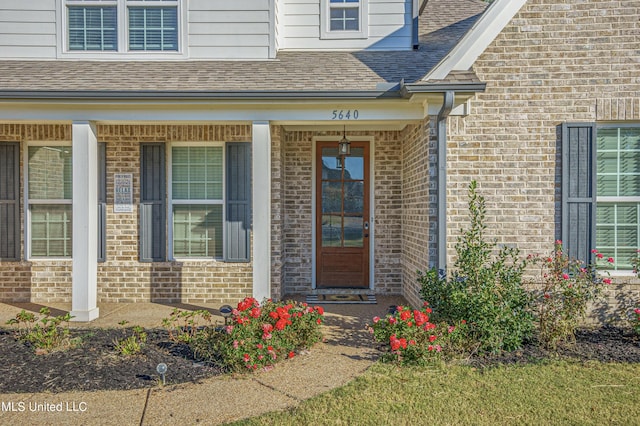 5640 Drew Glazer Dr, Olive Branch, MS 38654 - entrance to property with brick siding, covered porch, and a shingled roof