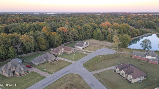 aerial view at dusk with a water view