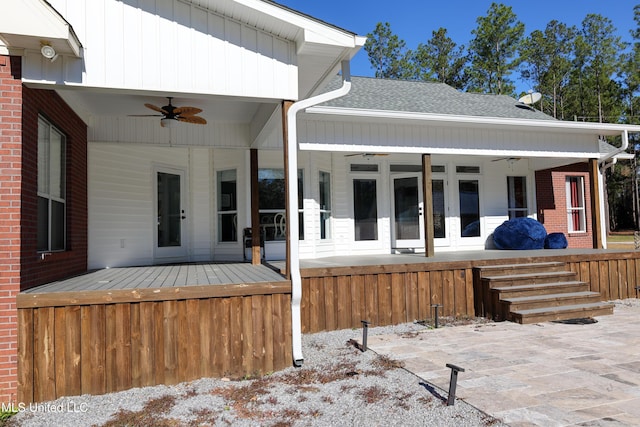 back of property with ceiling fan