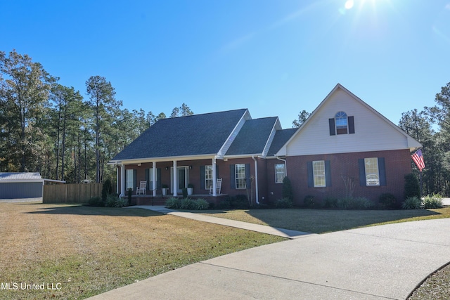 view of front of property with a porch and a front yard