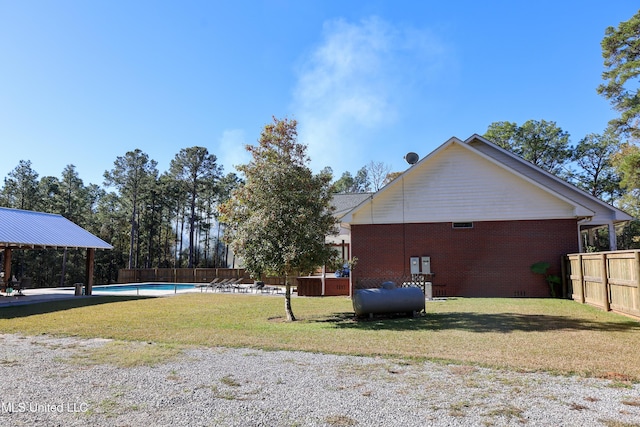 view of yard with a gazebo and a fenced in pool