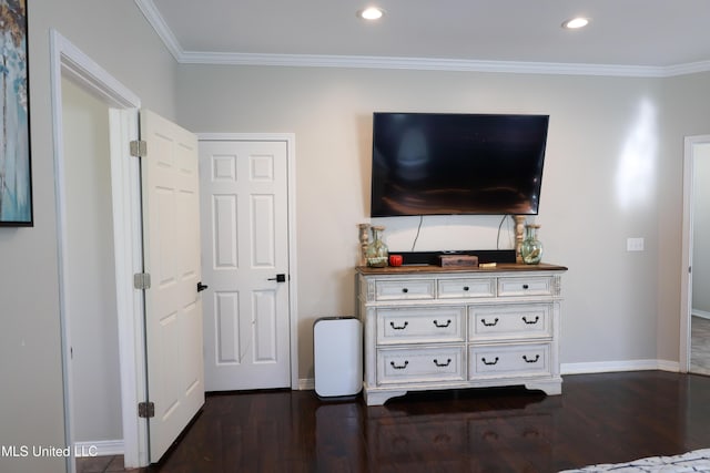 bedroom featuring dark wood-type flooring and ornamental molding