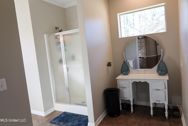 bathroom with tile patterned flooring, vanity, and an enclosed shower