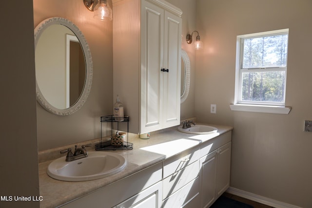 bathroom with a wealth of natural light and vanity