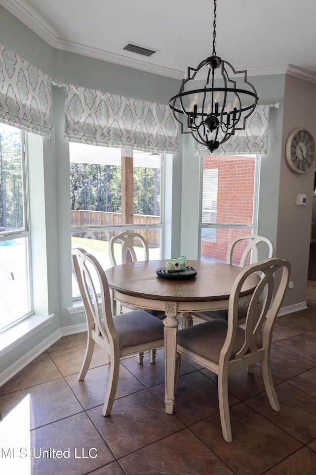 dining space with a notable chandelier and crown molding