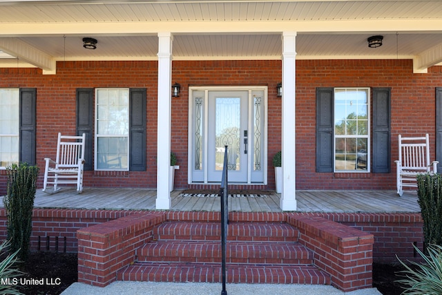 entrance to property with a porch