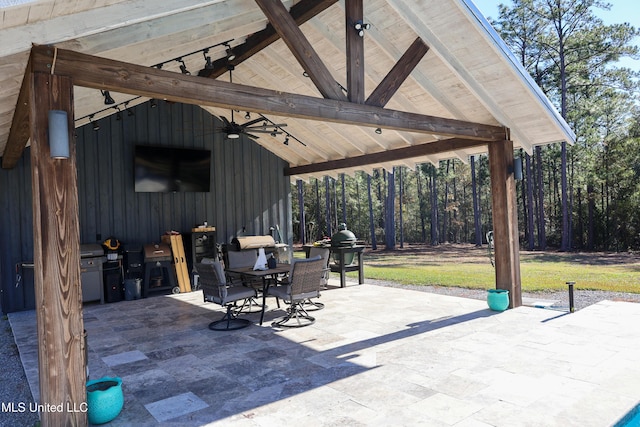 view of patio with a gazebo and ceiling fan