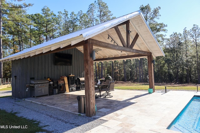 view of home's community featuring a gazebo, a patio area, and a pool