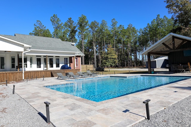 view of swimming pool featuring a patio area